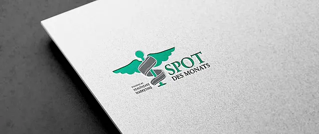 Das Logo von der Auszeichnung Spot des Monats powered by Healthcare Marketing