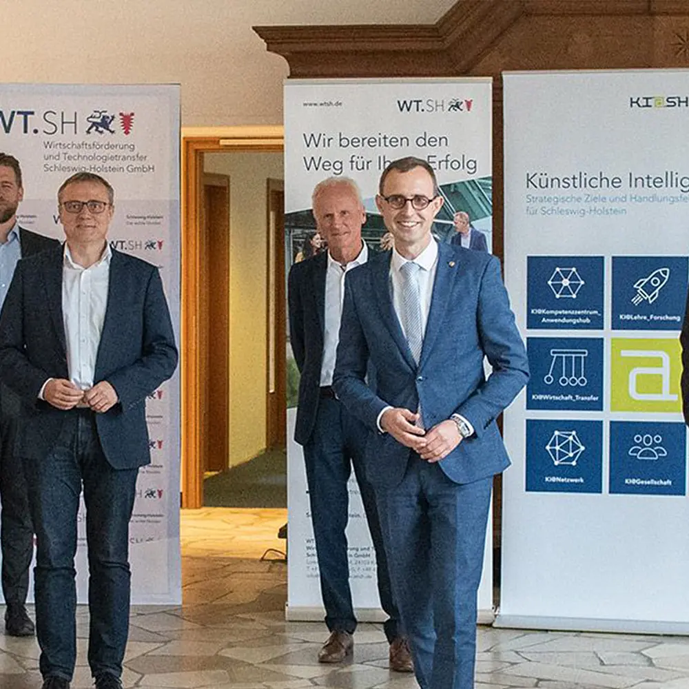 Vier männliche Mitglieder des KI Netzwerks